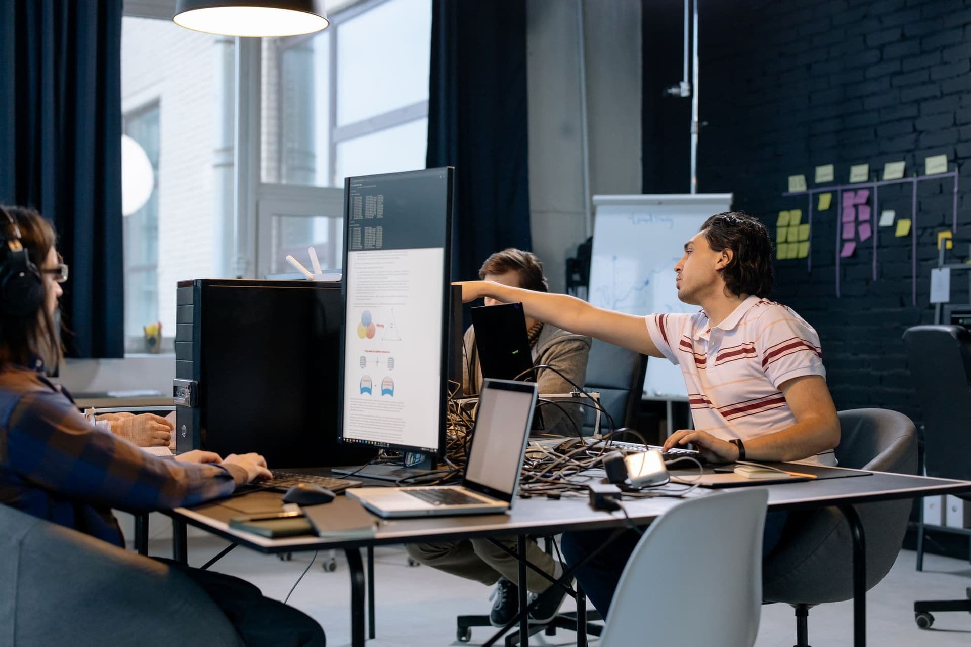 Software team working together in an open-plan office